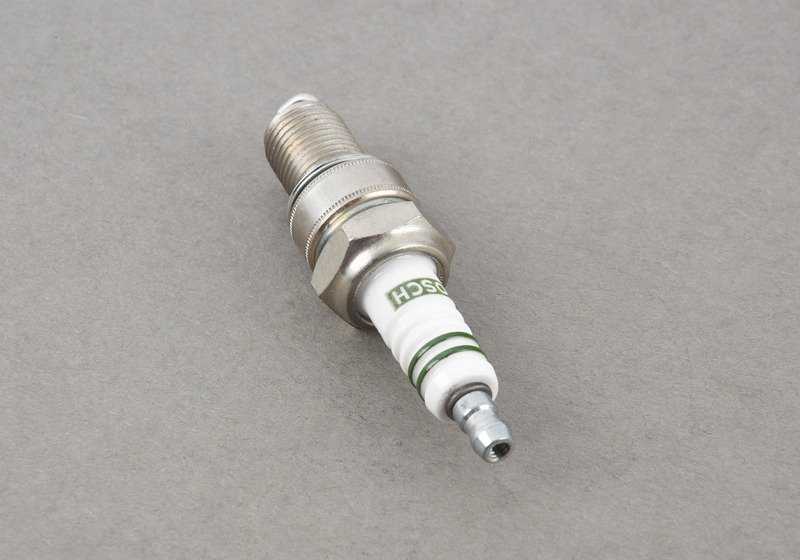 Spark plug for BMW E12 (OEM 12121338145). Original BMW