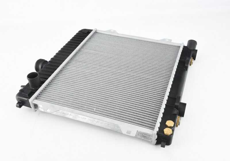 Water radiator with transmission oil cooler for BMW E30, E28 (OEM 17111707811). Original BMW