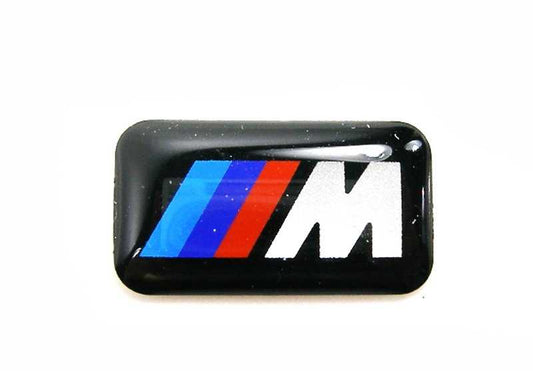 Emblem M Performance OEM 36112228660 for BMW (Compatible models: E81, E82, E87, E88, F20, F21, F40, F52, F22, F23, F44, F45, F46, F87, G42, U06, E36, E46, E90, E91 , E91, e92, e93, f30, F31, F34, F35, F80, G20, G21, G28, G80, F32, F33, F36, F82, F83, G.