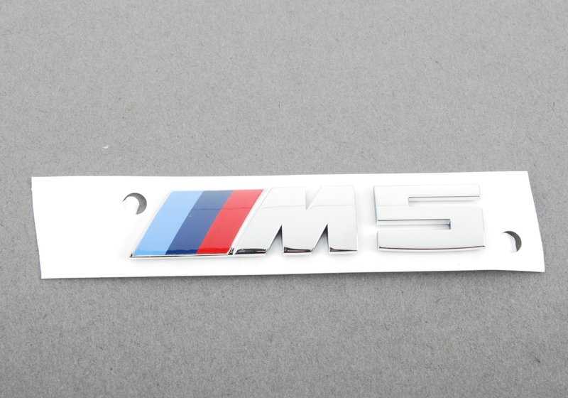 Emblem for various BMW models/series (OEM 51138059945). Genuine BMW.